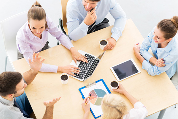 colleagues working in office high angle