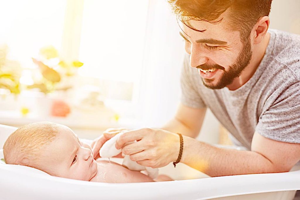 Father with baby parental leave Ontario Pivotal HR Solutions Blog