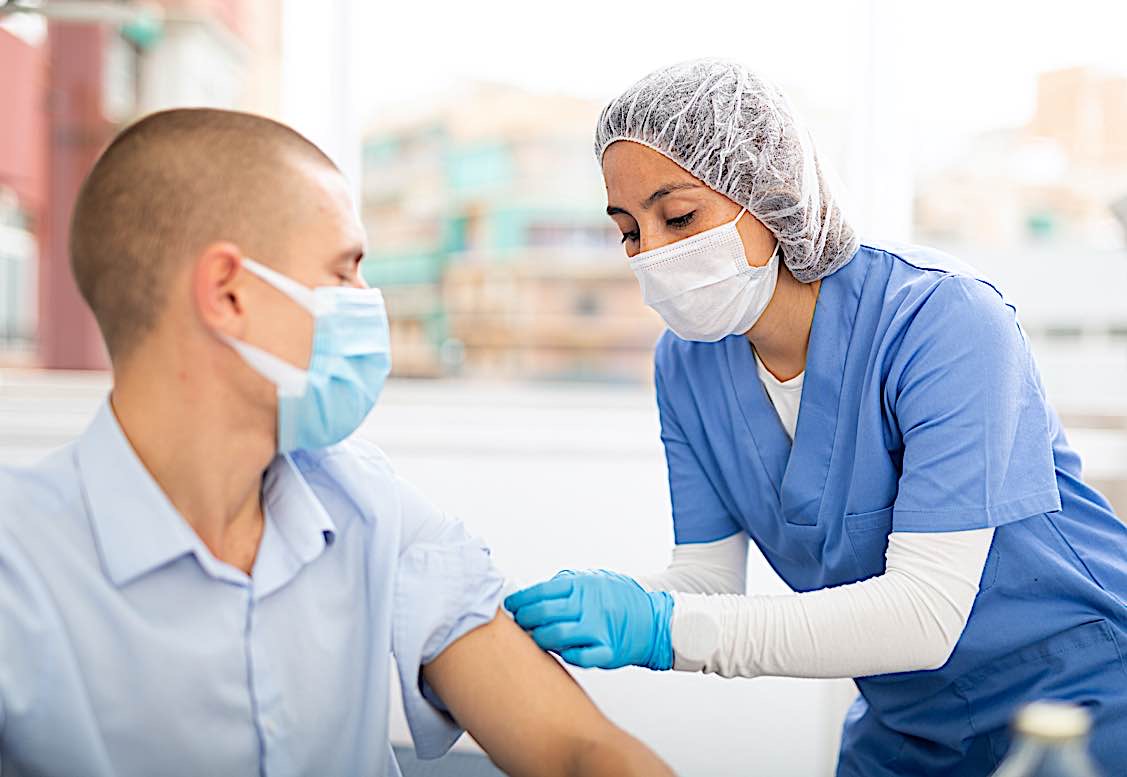 Covid-19 workplace vaccination clinic. Whether employers can mandate proof of vaccination is discussed in Pivotal HR Solutions in-depth feature.