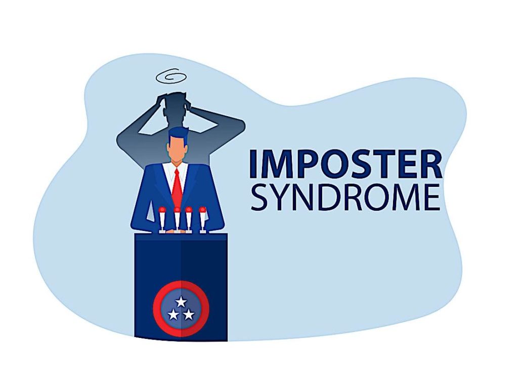 Imposter Syndrome a business plan at a podium while his shadow hands back in fear dreamstime l 224094926 Pivotal HR Solutions Blog