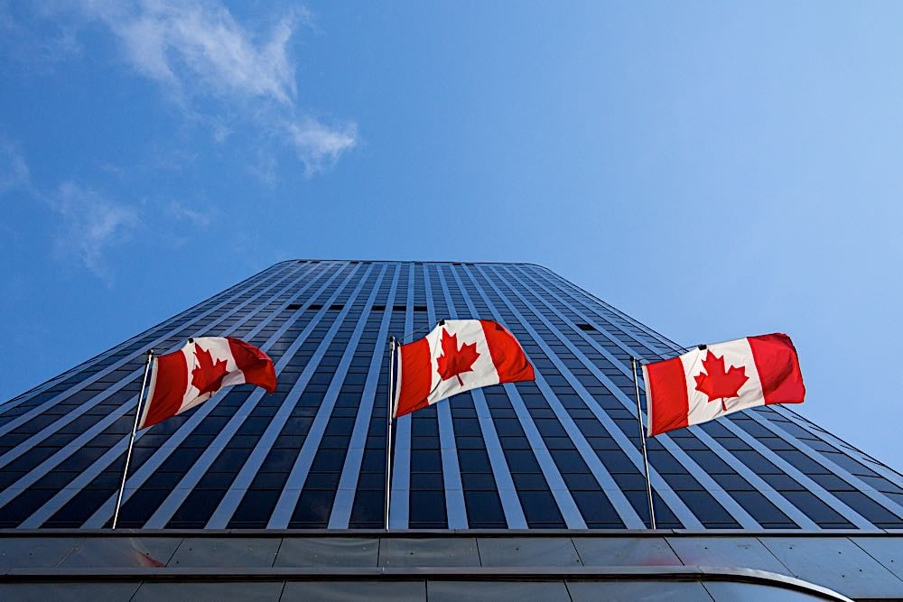 Canadian flags on business building Ottawa dreamstime xl 146978257 Pivotal HR Solutions Blog