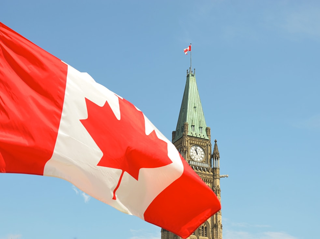 Flag of Canada in front of Parliament Hill