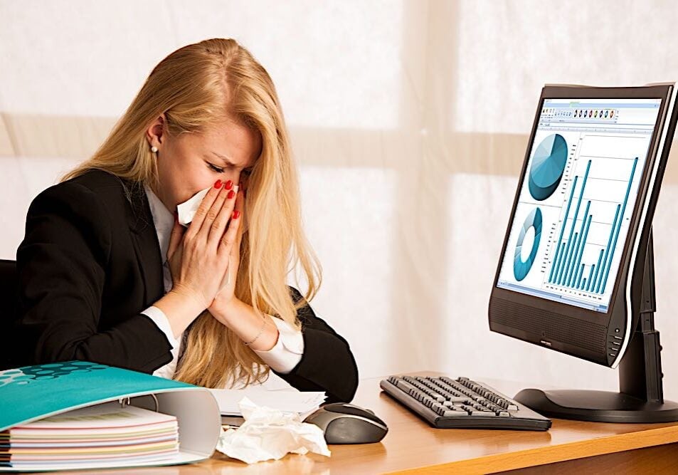 woman with flu in office dreamstime_xl_109622154- Pivotal - HR - Solutions - Blog There are a number of pro-active tactices employers can offer employees to help keep flu and covid viruses from spreading in the office, such as remote work, paid sick leave, and health policies.
